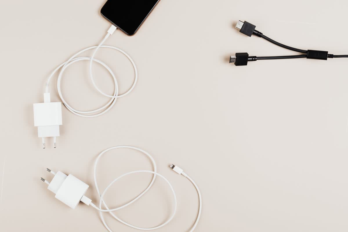 Chargers and cables laid out on a desk