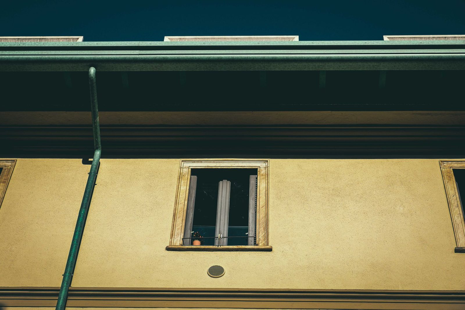 Clean gutters and downspout on a house exterior