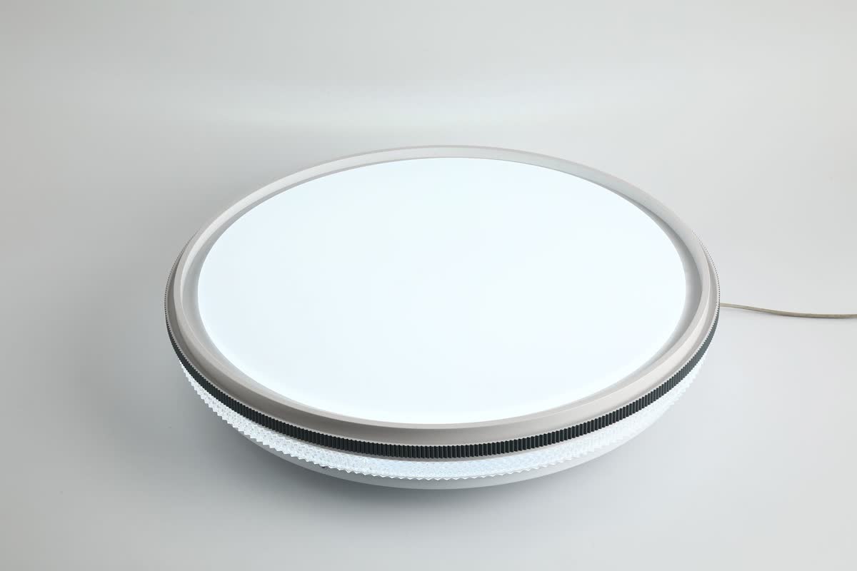 A small round stick-on tap light